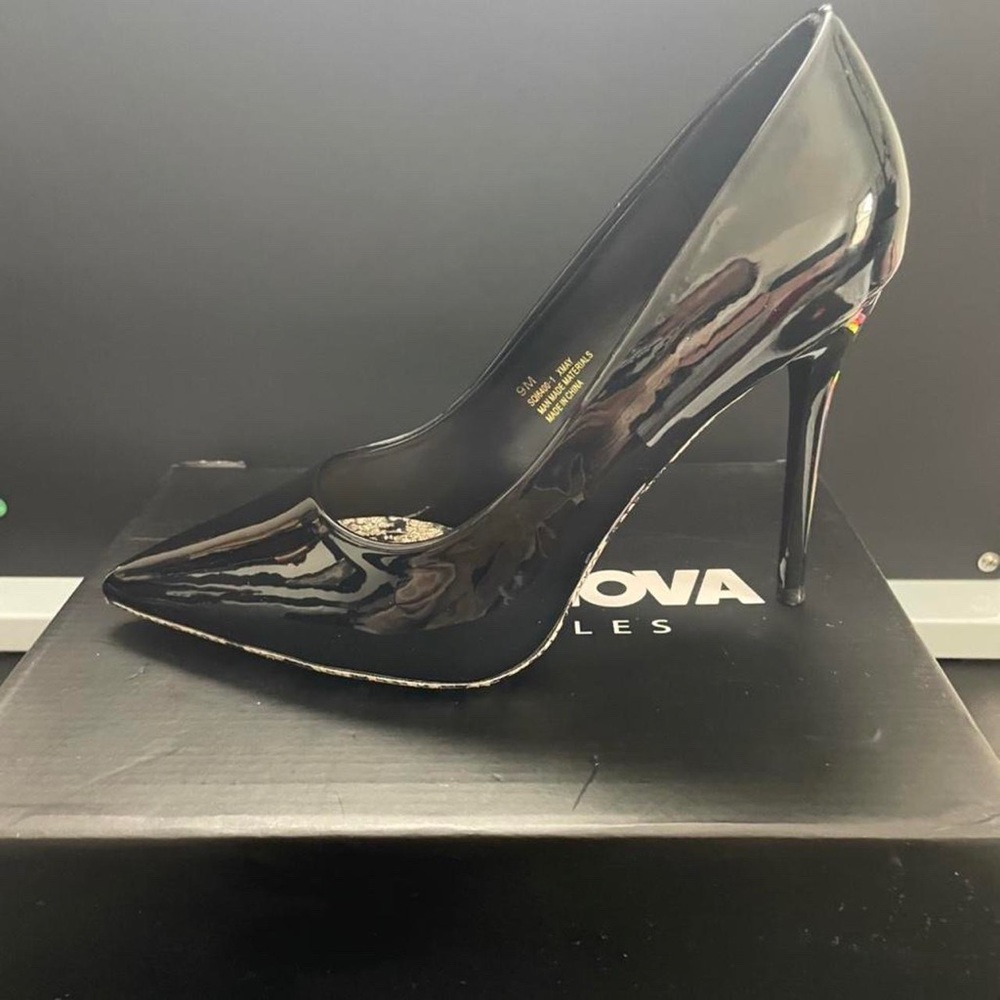 Black heels with snake pink sole